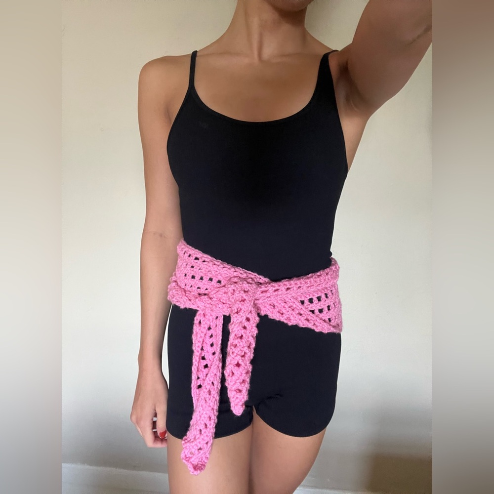 Pink homemade crochet accessory. ~67in in length.